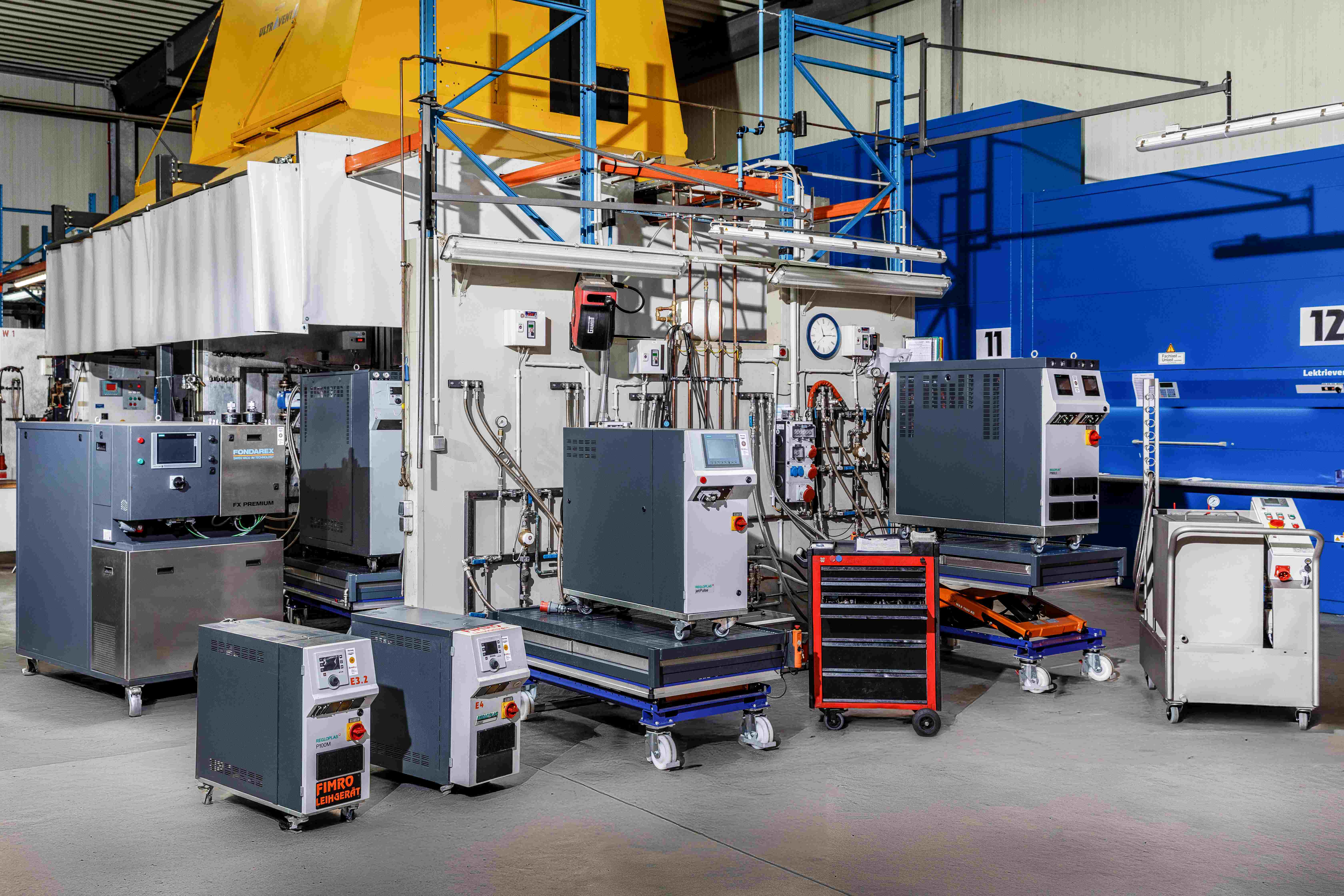 View into FIMRO workshop with test benches for service, repair and maintenance temperature control units and warehouse for fast spare parts